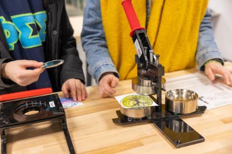 Students using a buttonmaker